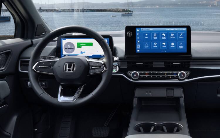 2026 Honda Prologue Elite interior with Gray Leather, featuring the cabin with dashboard and steering wheel.